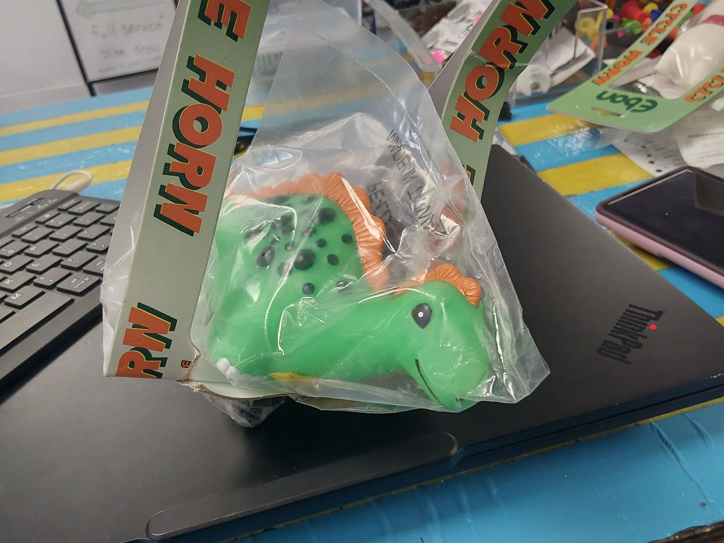 Ebon smiling green dinosaur horn