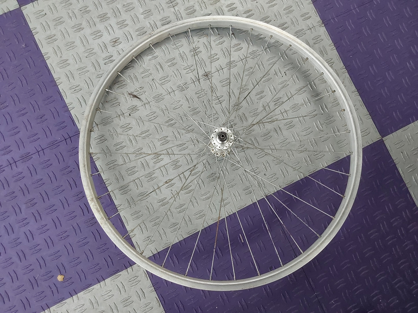 FRONT WHEEL - 26', generic rim, Shimano parallax hub, bolt-on
